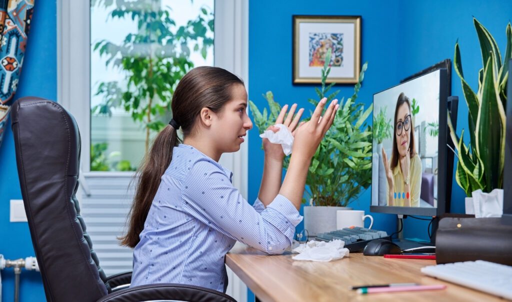 teenager speaking to therapist online