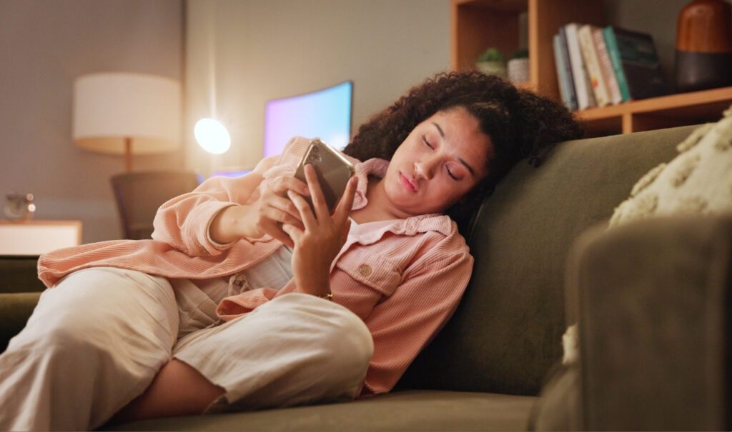 woman doomscrolling on her phone