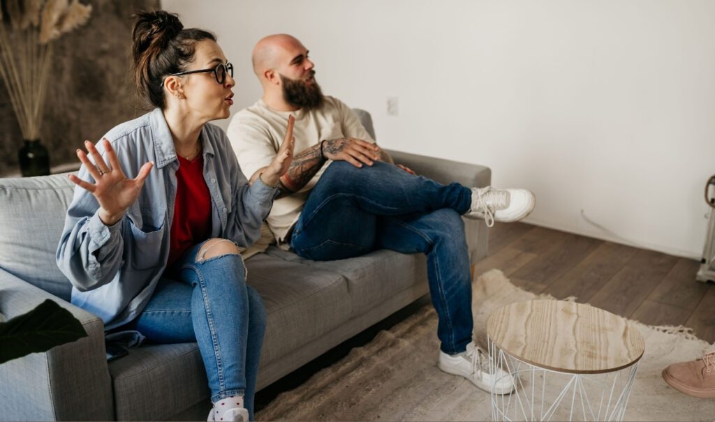couple on therapist couch discussing passionately